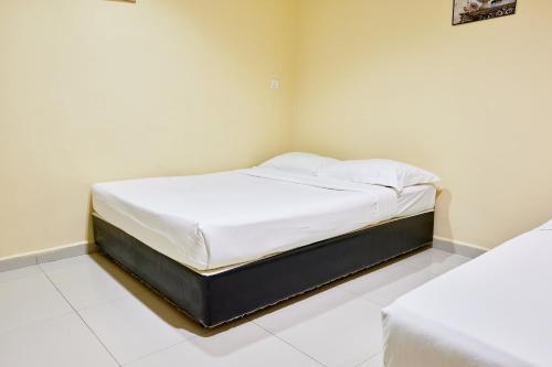 Una cama o camas en una habitación de Hotel Inap Sri Gombak