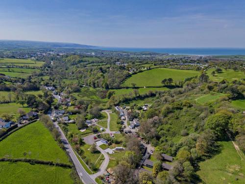 an aerial view of a small village on a hill at Bluebell - Bude in Bude