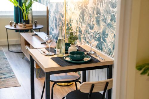 a table with a plate of food on top of it at Stylish City Centre getaway with Cathedral Views in Canterbury