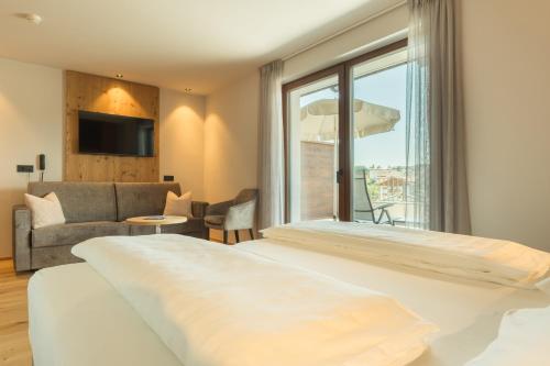 Postel nebo postele na pokoji v ubytování Parc Hotel Tyrol