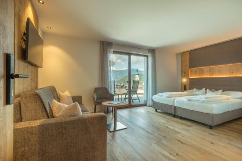 Postel nebo postele na pokoji v ubytování Parc Hotel Tyrol