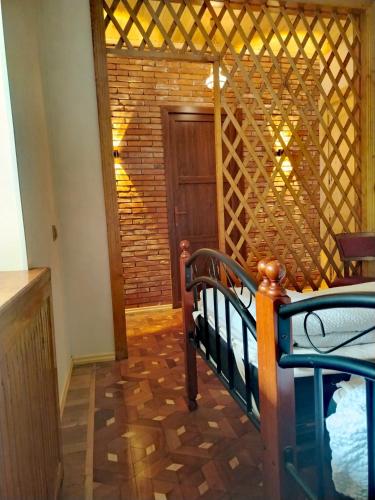 a room with a staircase and a room with a door at Discover Kinchkha in Satsiskvilo