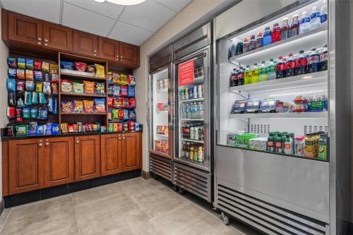 a room with two refrigerators and drinks at Drury Plaza Hotel St Louis Creve Coeur in Creve Coeur