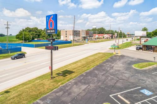 a sign for a gas station on a street at Motel 6-Milan, OH - Sandusky in Milan