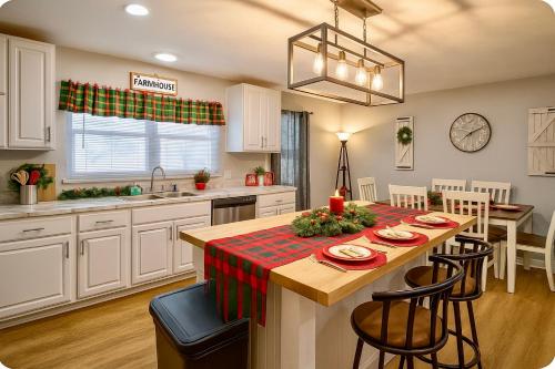 a kitchen with a table with a christmas table cloth at 3BR Holiday Home Sleeps 6 Fully Equipped Kitchen in Knoxville