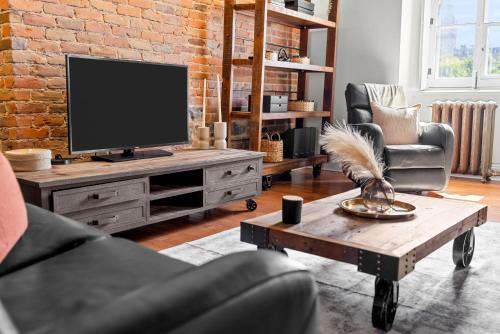 ホテル マノワール ドトゥイユにあるテレビまたはエンターテインメントセンター