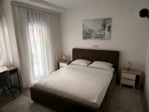 Postel nebo postele na pokoji v ubytování ALDA Apartmani Vranje