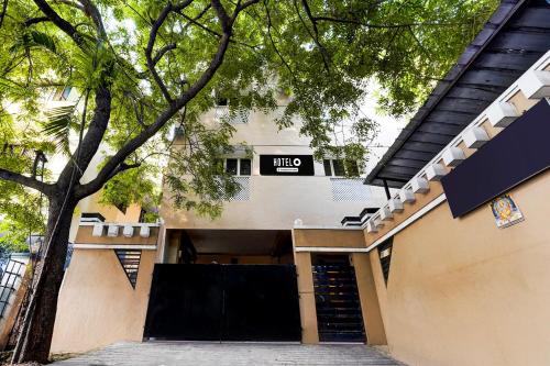 a building with a sign that reads hilti at Super Hotel O Chrompet Near Rela Hospital in Chennai