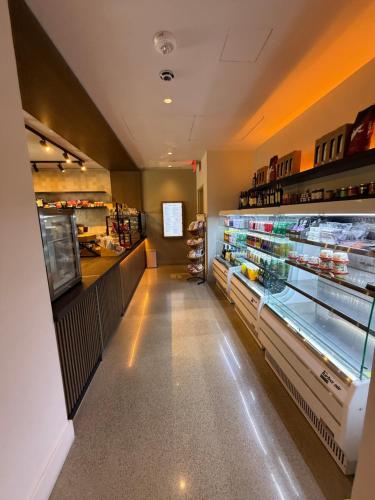 a grocery store aisle with a large display case at Stunning Lux 2 Bed 2 Bath with Panoramic View from Balcony in Miami