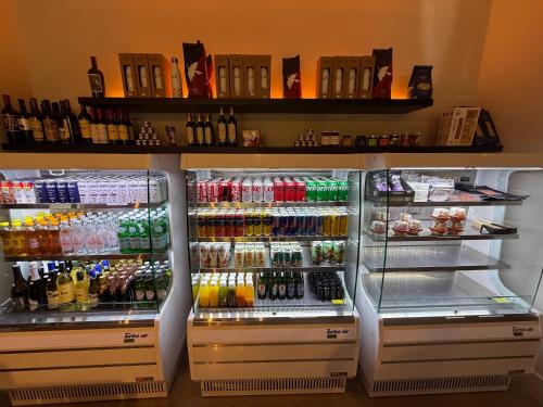 a refrigerator filled with lots of different types of drinks at Stunning Lux 2 Bed 2 Bath with Panoramic View from Balcony in Miami