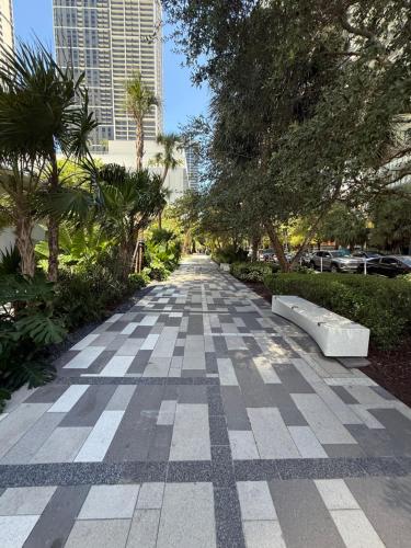 a sidewalk in a city with trees and buildings at Stunning Lux 2 Bed 2 Bath with Panoramic View from Balcony in Miami