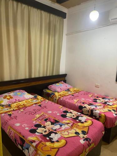 Postel nebo postele na pokoji v ubytování bluebay asia chalet بلوباي اسيا