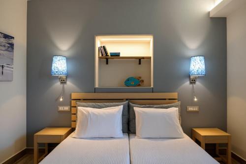 Ένα ή περισσότερα κρεβάτια σε δωμάτιο στο Sergiani Garden Hotel Apartments
