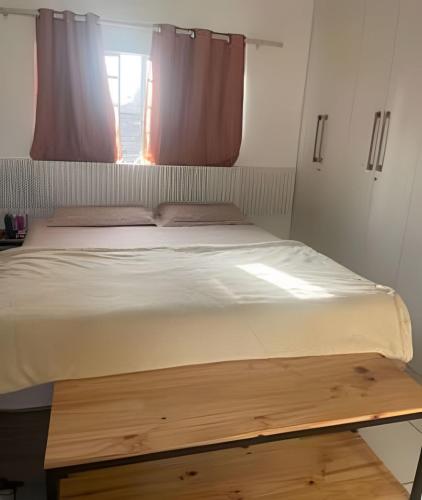 a large bed in a room with a window at Orla de Macapá in Macapá
