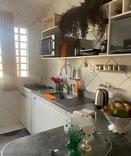 a kitchen with a counter with a bowl of fruit at Orla de Macapá in Macapá