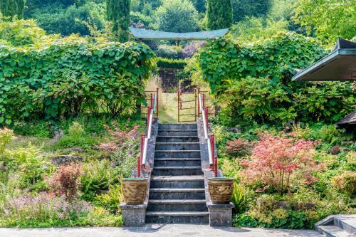 a set of stairs in a garden with plants at 1 Bed in Tollard Royal oc-j32937 in Tollard Royal