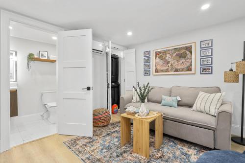 a living room with a couch and a table at North End Entire House in Boston