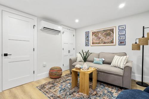 a living room with a couch and a table at North End Entire House in Boston