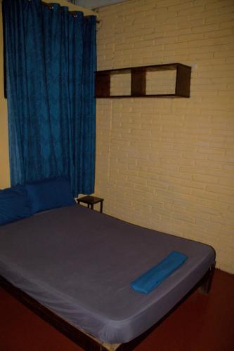 Postel nebo postele na pokoji v ubytování Shalom Backpacker Hostel