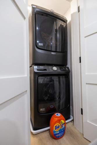 a microwave sitting on top of a toaster oven at North End Entire House in Boston