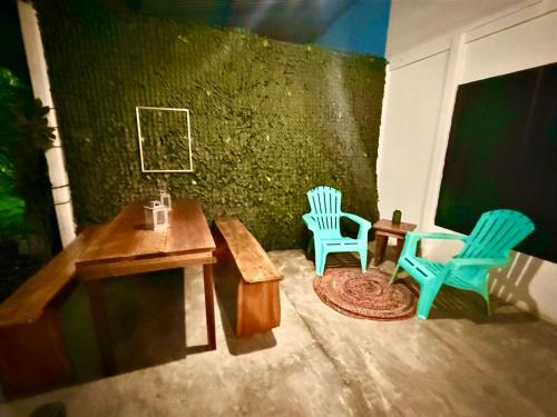 a room with two chairs and a table and two chairs at Villas Itaita Beach Cabins in Punta Uva