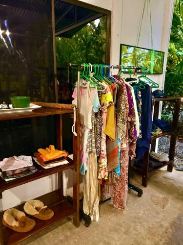 a bunch of clothes are hanging on a rack at Villas Itaita Beach Cabins in Punta Uva