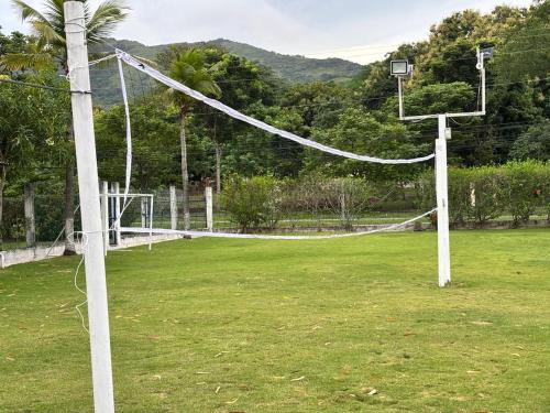 a volleyball net in a field with at Majagual Beach House in Veracruz