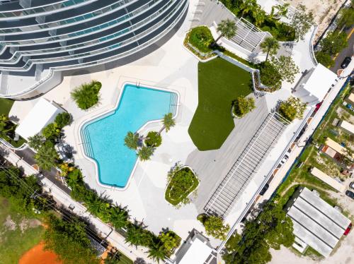 an overhead view of a building with a pool at Flow Brickell Hotel in Miami