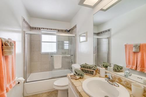 a bathroom with a sink and a toilet and a shower at Near Sun Splash Waterpark Coral Princess Oasis in Cape Coral