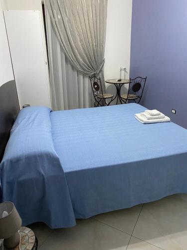 Postel nebo postele na pokoji v ubytování B&B LA CASA DI GIORGIA DI PELLICANO' FRANCESCA
