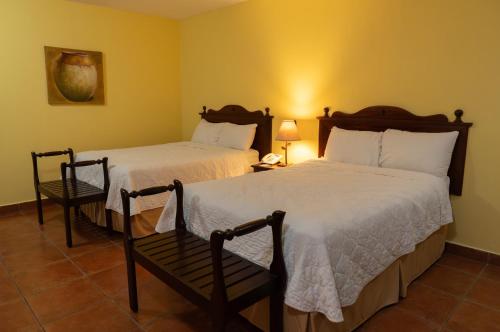 Ένα ή περισσότερα κρεβάτια σε δωμάτιο στο Hotel Villa Terra
