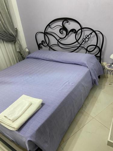 Postel nebo postele na pokoji v ubytování B&B LA CASA DI GIORGIA DI PELLICANO' FRANCESCA