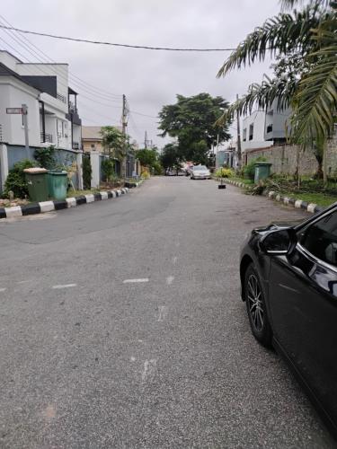 a black car parked on the side of a street at Eko Luxury Apartments in Ikeja