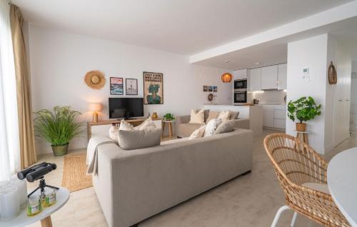 a living room with a couch and a table at Experience Elevated Living at this Pure South Penthouse in Manilva