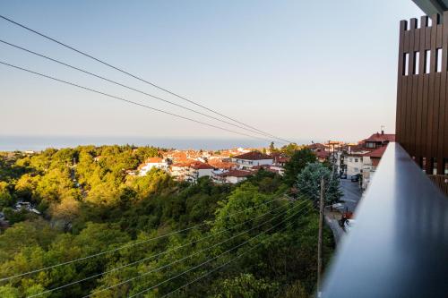 a view of a city from a building at Thea Experience in Litochoro