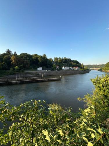a river with a pier in the middle of it at FerienWohnung Gästehaus Merzig-Besseringen NEUBAU in Merzig