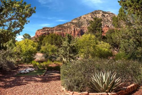 a garden with a mountain in the background at Sedona Retreat with Hot Tub and Views for Family in Sedona