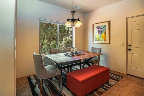a dining room with a table and chairs and a window at Sedona Retreat with Hot Tub and Views for Family in Sedona