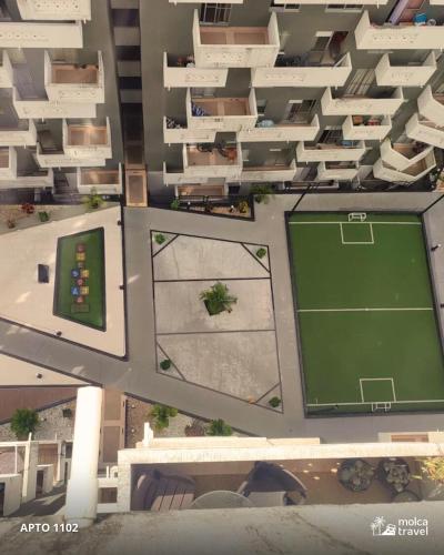an overhead view of a tennis court in a building at Apartamento en Armenia - Edificio Ambar - Con Piscina - By Molca Travel in Armenia