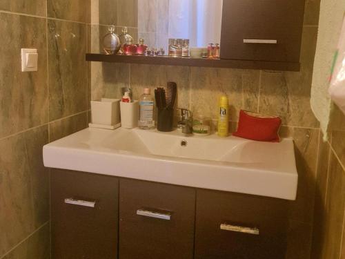 a bathroom sink with a red pillow on it at Holiday Home in Likoporia near Beaches in Likoporiá