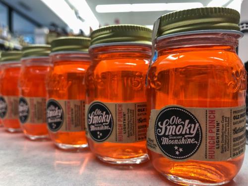 a row of jars of honey on a shelf at Smoky Bear Splash Top Rated Private Pool Cabin with Hot Tub, Mtn Views, Arcade Games, Excellent Location in Pigeon Forge