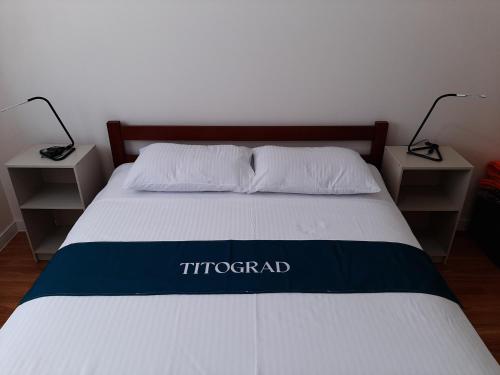 Postel nebo postele na pokoji v ubytování Titograd