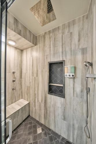 a bathroom with a shower stall and a shower at Houston Towers Inn, Adults-Only, Downtown, Med Ctr, NRG in Houston