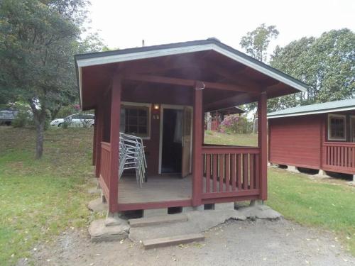 a small cabin with a porch and a deck at Eleven Auto Camp Park - Vacation STAY 44746v in Kururi