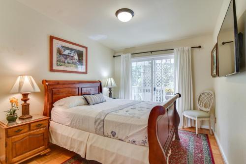 a bedroom with a bed and a window at 12 Mi to Portland Aloha Home with Private Backyard in Aloha