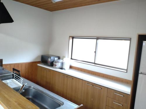 a kitchen with a sink and a window at Tentengo Shibu River - Vacation STAY 76449v in Ono