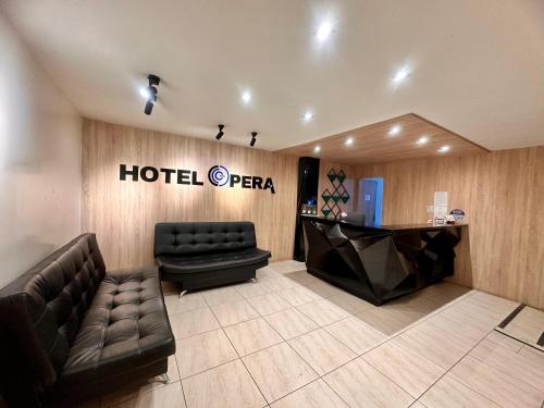 a hotel pera lobby with a couch and a desk at Hotel,Medellin,Opera,Entertaiment,Only adults,Turismocolombia-fit in Medellín