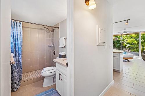 a bathroom with a toilet and a shower and a sink at Napili Ridge - Vacation West Maui in Lahaina