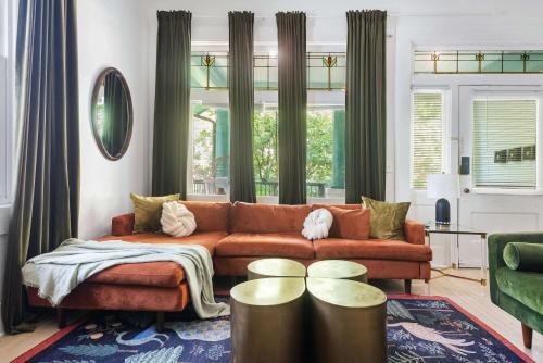 a living room with a couch and a table at Mystique in Atlanta