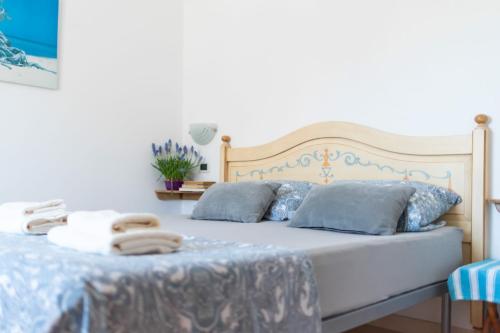 Ένα ή περισσότερα κρεβάτια σε δωμάτιο στο casa su rimediu